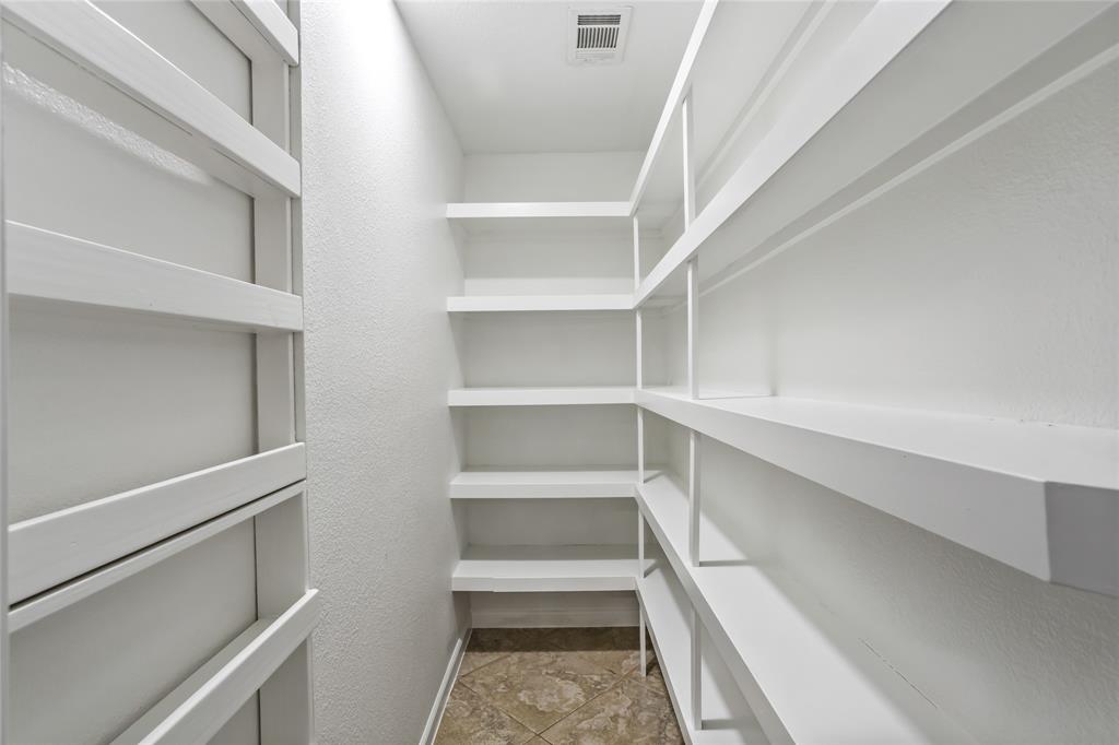 13510 Willow Springs Road Haslet, TX 76052 - Photo 16 of 39 a view of walk in closet with empty racks