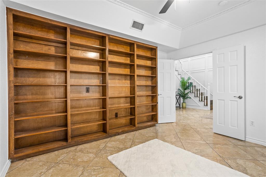 13510 Willow Springs Road Haslet, TX 76052 - Photo 18 of 39 a view of an empty room with cabinet and a window