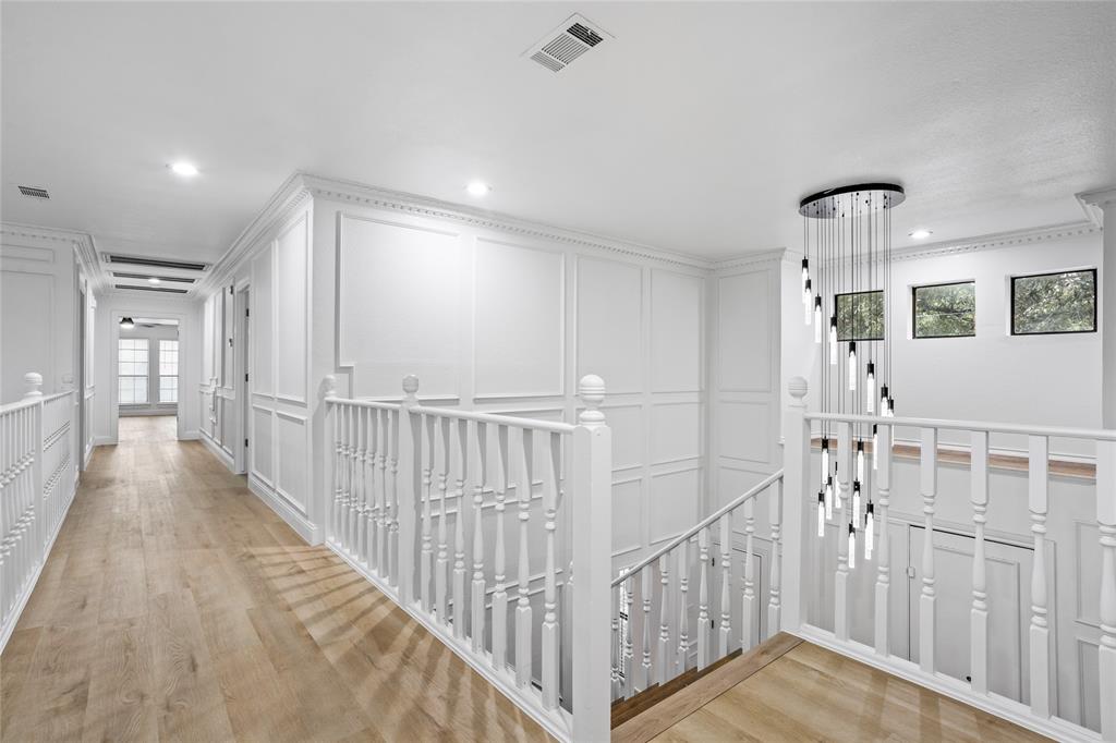 13510 Willow Springs Road Haslet, TX 76052 - Photo 21 of 34 a view of a hallway with windows