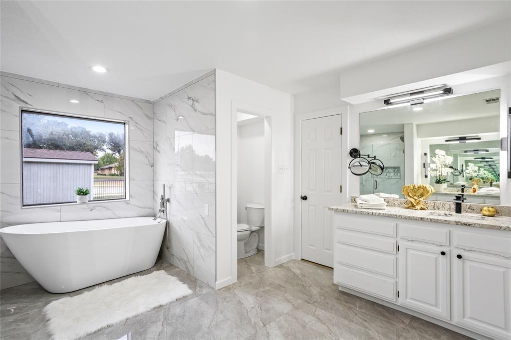 13510 Willow Springs Road Haslet, TX 76052 - Photo 22 of 39 a bathroom with a bathtub and a sink