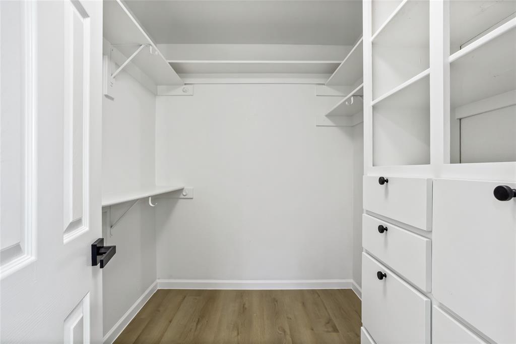 13510 Willow Springs Road Haslet, TX 76052 - Photo 23 of 39 a view of walk in closet with empty racks