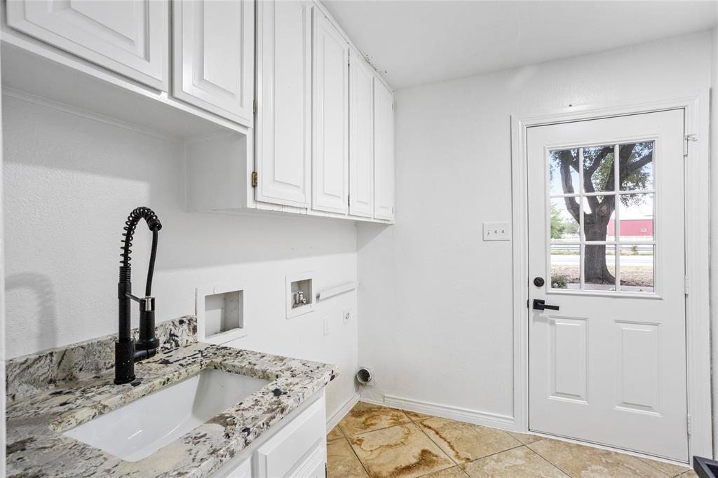 13510 Willow Springs Road Haslet, TX 76052 - Photo 25 of 39 a bathroom with a granite countertop sink and a mirror
