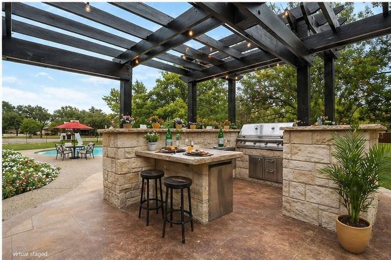 13510 Willow Springs Road Haslet, TX 76052 - Photo 27 of 34 a view of a patio with table and chairs potted plants and a large tree