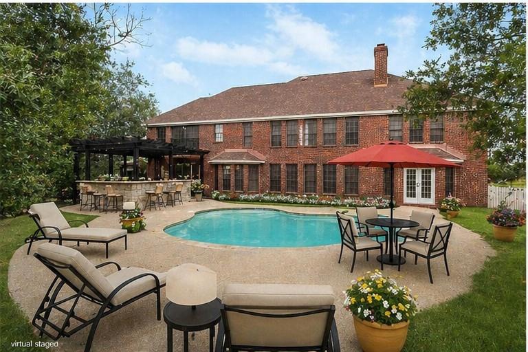 13510 Willow Springs Road Haslet, TX 76052 - Photo 29 of 34 a swimming pool view with a seating space