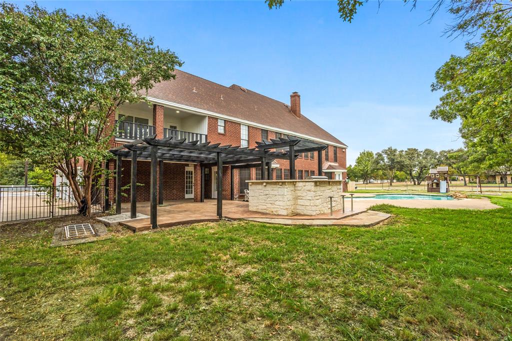 13510 Willow Springs Road Haslet, TX 76052 - Photo 34 of 39 a view of a house with swimming pool and a yard