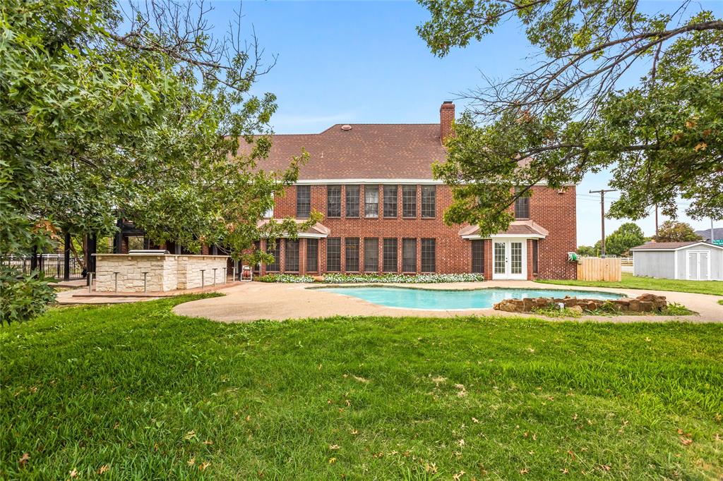 13510 Willow Springs Road Haslet, TX 76052 - Photo 35 of 39 a view of a house with swimming pool and a yard