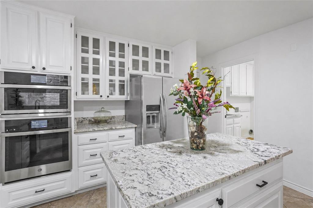 13510 Willow Springs Road Haslet, TX 76052 - Photo 6 of 34 a view of kitchen with stainless steel appliances granite countertop cabinets and potted plant