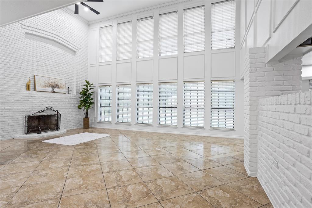 13510 Willow Springs Road Haslet, TX 76052 - Photo 7 of 39 a view of an empty room with a fireplace and a window