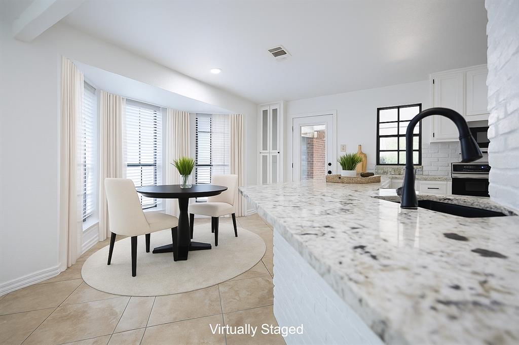 13510 Willow Springs Road Haslet, TX 76052 - Photo 10 of 39 a view of a dining room with furniture