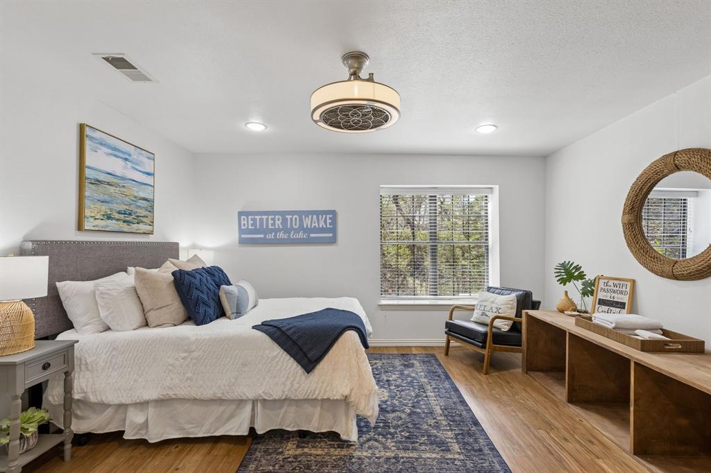41 White Oak Road Gainesville, TX 76240 - Photo 27 of 40 a bedroom with a bed and window