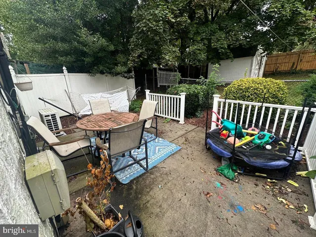 a view of an outdoor sitting area with furniture