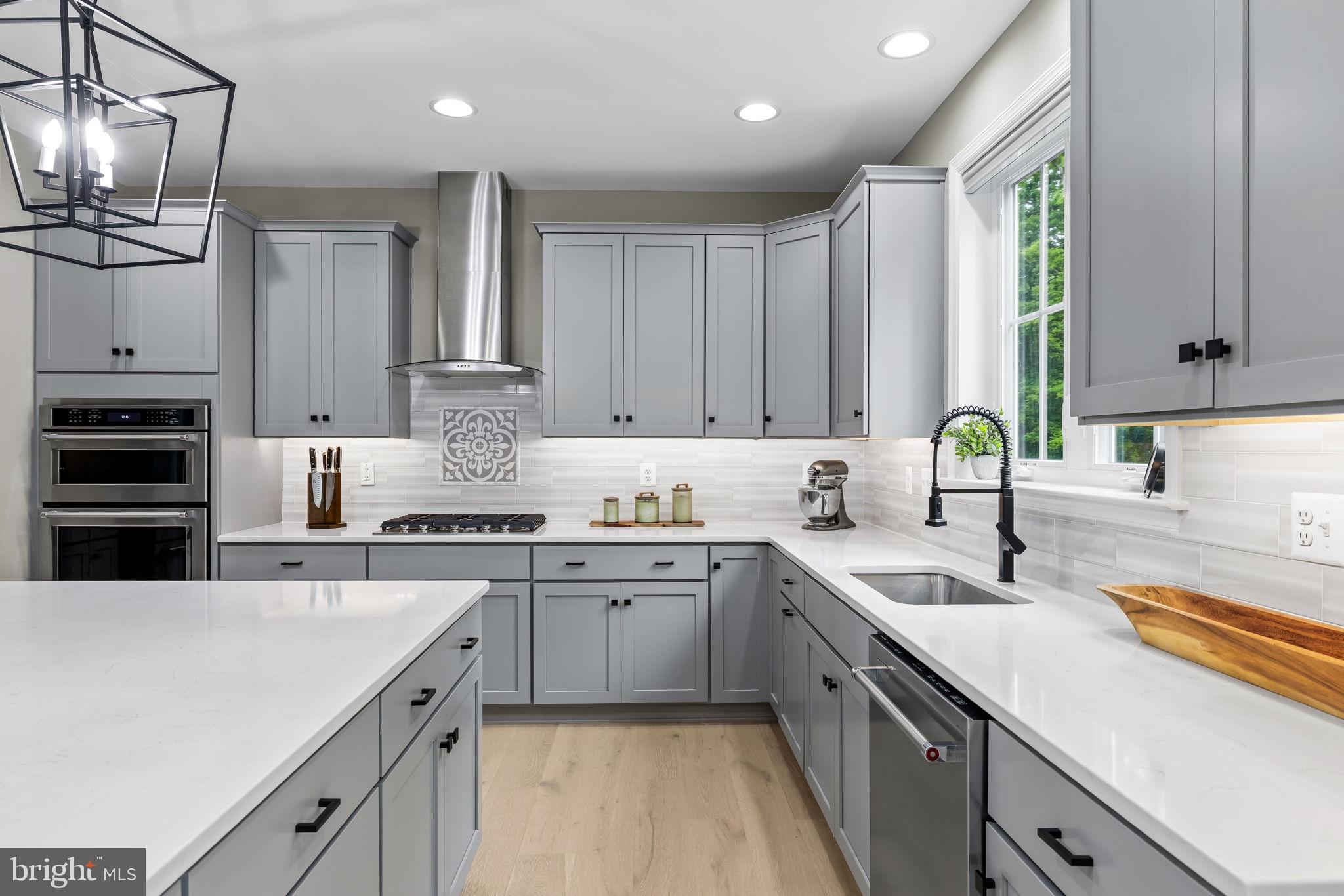14536 Black Ankle Road Mount Airy, MD 21771 - Photo 5 of 41 Modern elegance in a sleek kitchen.
