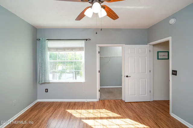 a view of a hallway view with staircase
