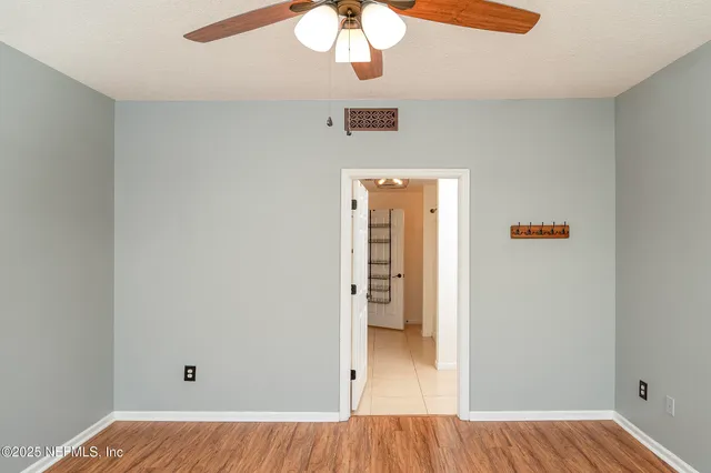 a view of a backyard with a tree
