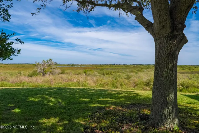 a view of a backyard with a sitting area