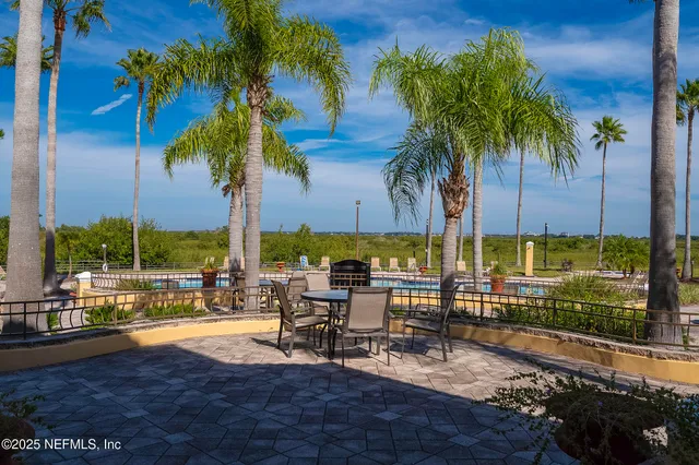 a kitchen with stainless steel appliances granite countertop a refrigerator sink and stove