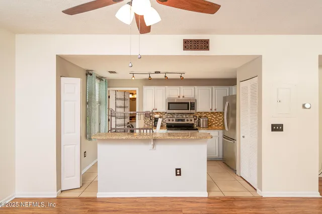 a view of balcony with wooden floor