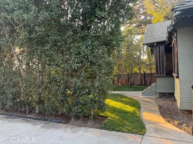 a view of a balcony with chairs and wooden floor