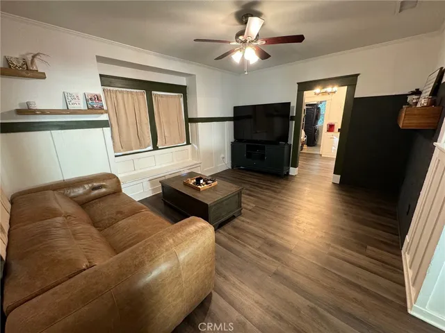 a kitchen with stainless steel appliances a sink a stove a refrigerator and island