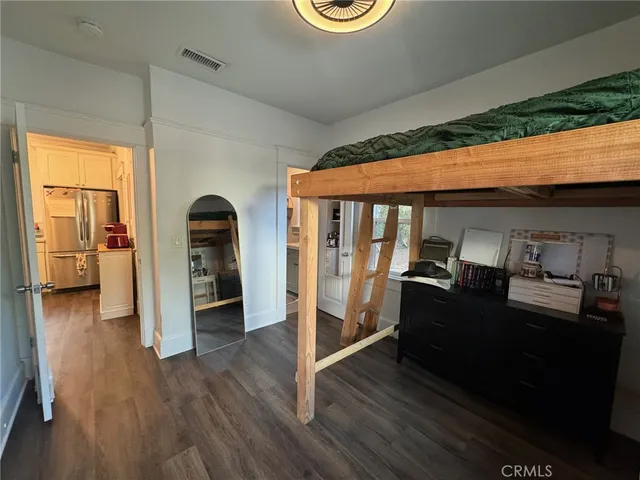 a storage room with furniture and wooden floor