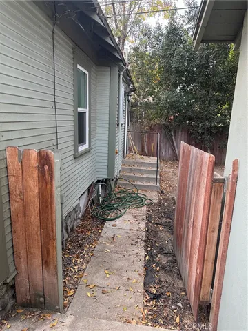 a view of a backyard with a large tree