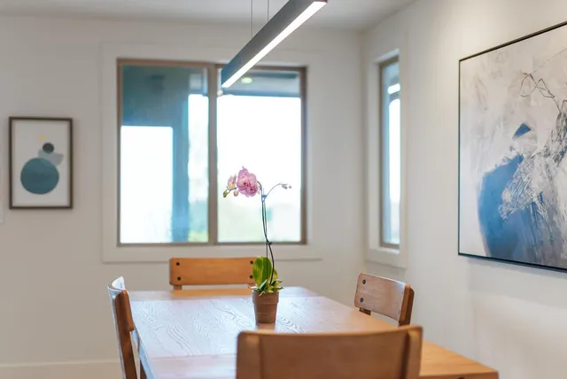 a bathroom with a tub and a chair