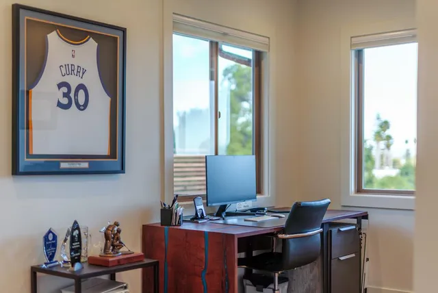 a view of a workspace with furniture
