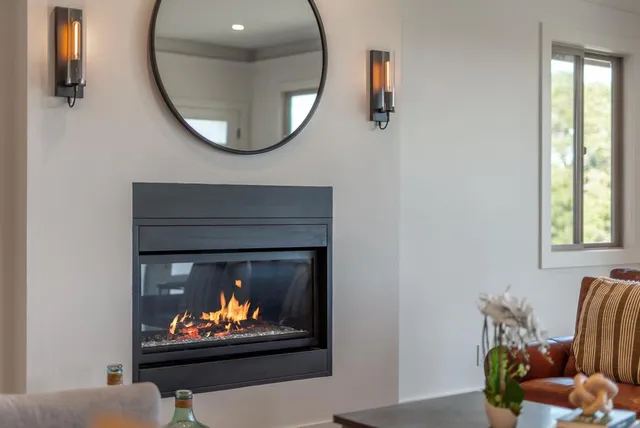 a living room with furniture and a fireplace