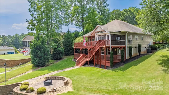 a view of a house with a yard porch and furniture