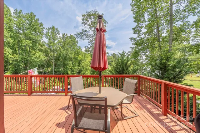 a view of a balcony with wooden floor
