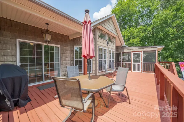 a view of a two chairs and table in the patio