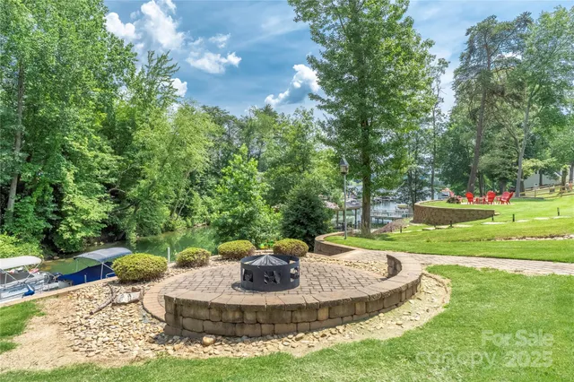 a swimming pool with trees in the background