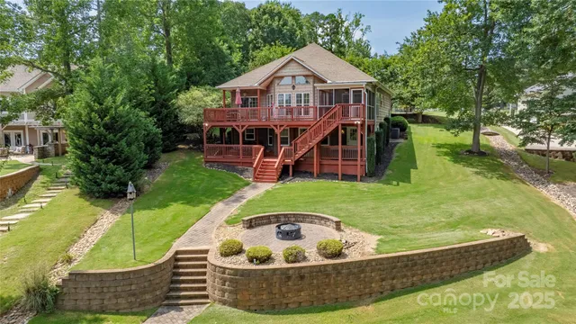 a view of a house with a yard balcony and sitting area