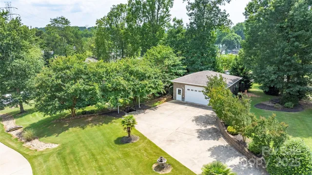 a view of a swimming pool with a yard