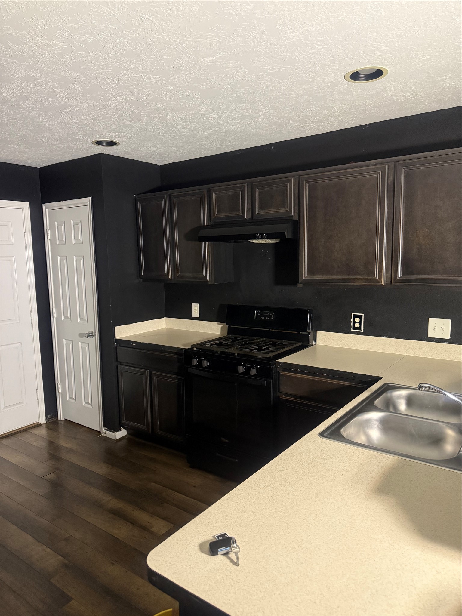 1119 Grassy View Drive Houston, TX 77073 - Photo 26 of 28 a kitchen with a sink and a stove
