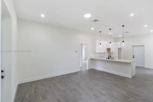 a view of kitchen with wooden floor