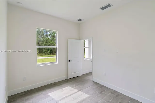 an empty room with windows