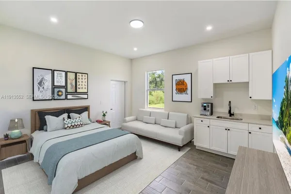 a bedroom with a bed and a couch