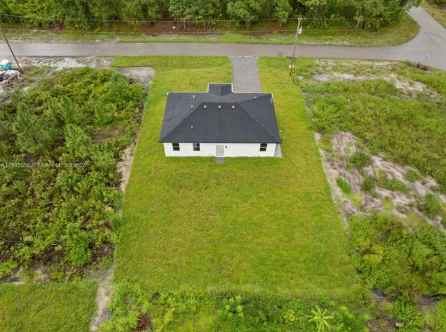 a view of a lake with a yard