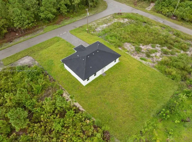 a view of a back yard of a house