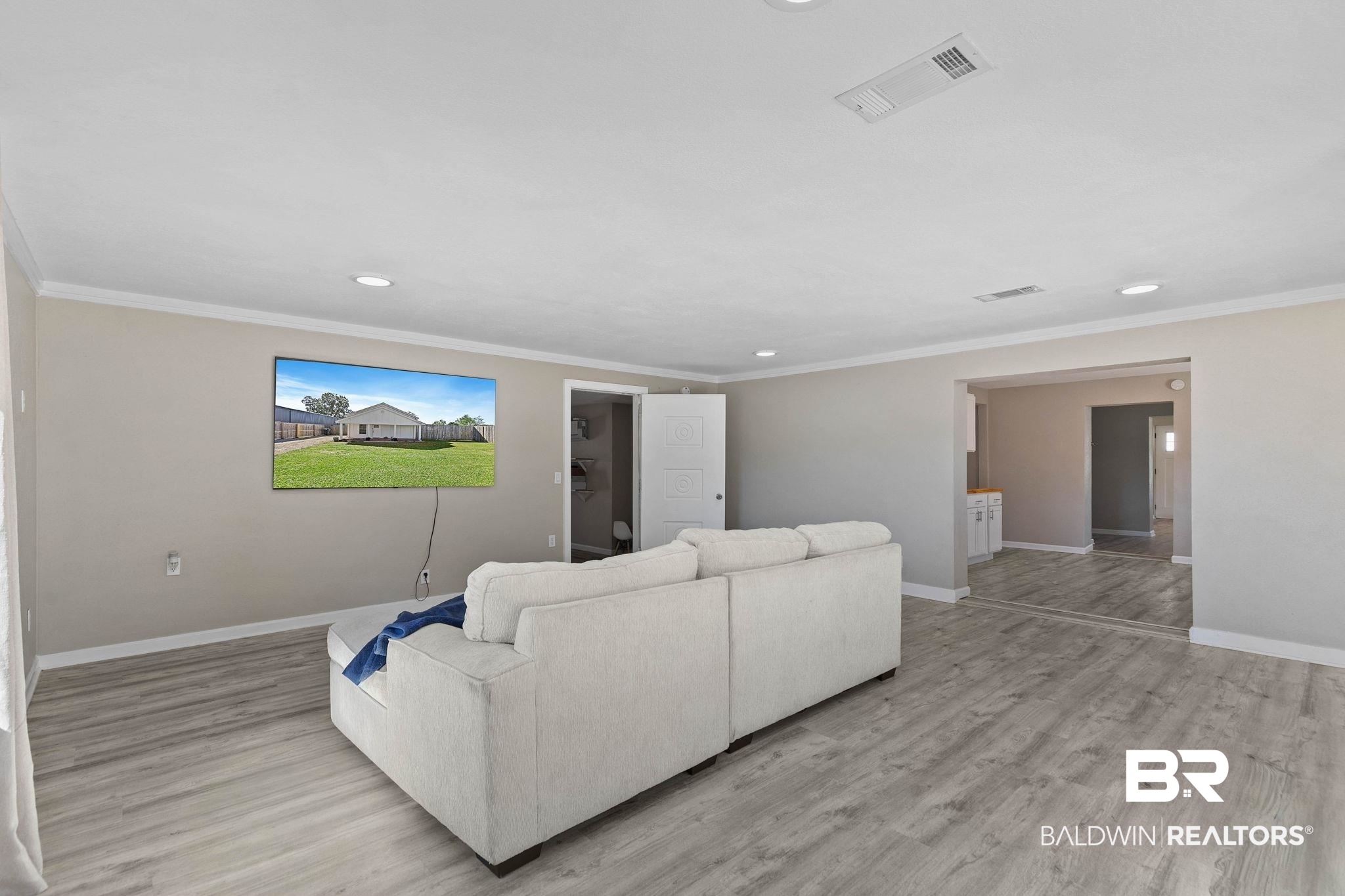 16796 Thompson Road Loxley, AL 36551 - Photo 22 of 93 Living room with crown molding, recessed lighting, and light wood finished floors