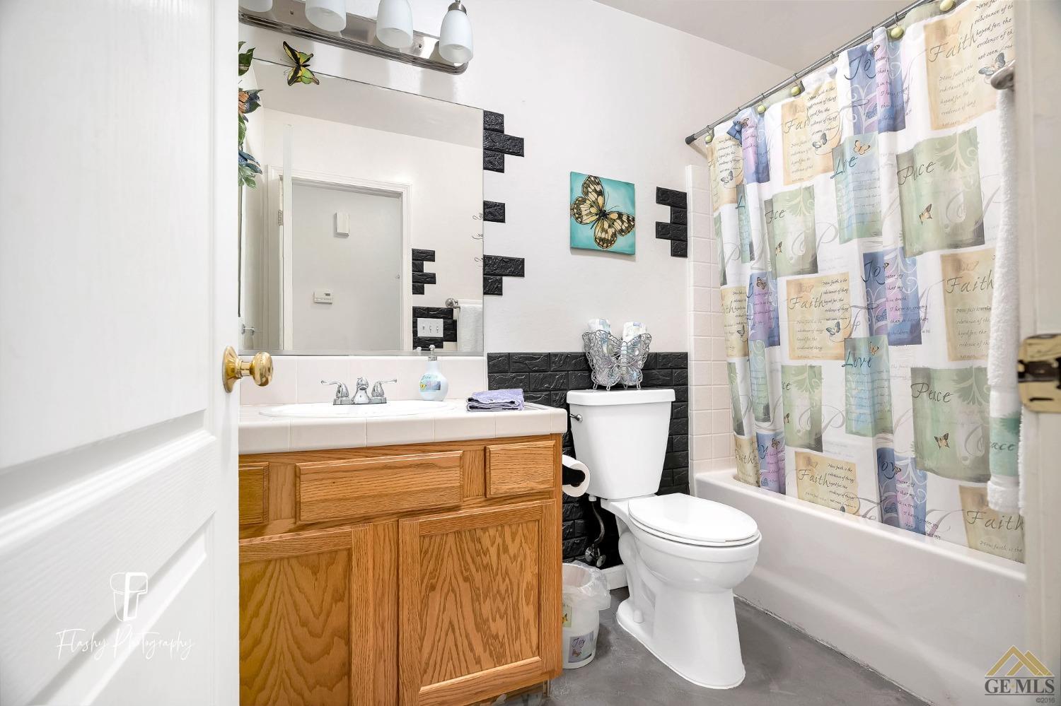 Undisclosed Address Bakersfield, CA 93308 - Photo 17 of 21 a bathroom with a sink a toilet and shower