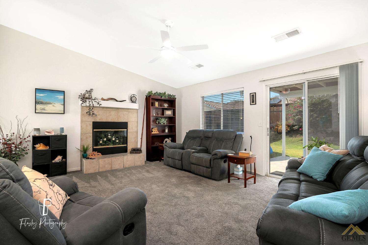 Undisclosed Address Bakersfield, CA 93308 - Photo 3 of 21 a living room with furniture and a fireplace