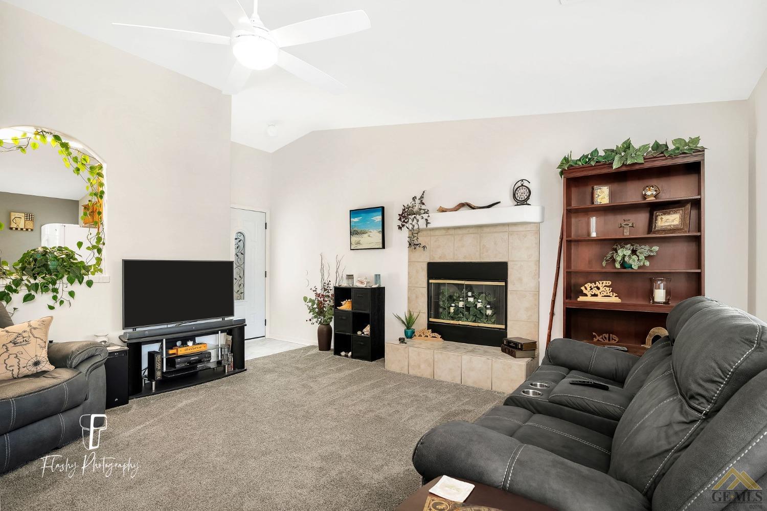 Undisclosed Address Bakersfield, CA 93308 - Photo 4 of 21 a living room with furniture and a flat screen tv