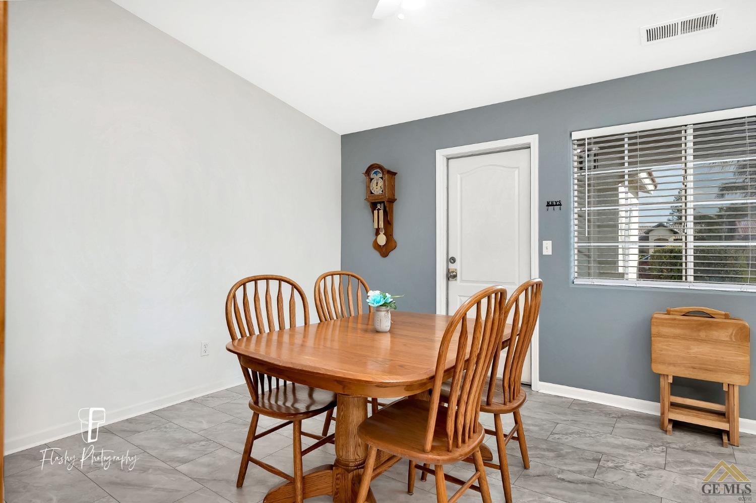 Undisclosed Address Bakersfield, CA 93308 - Photo 9 of 21 a view of a dining room with furniture and window