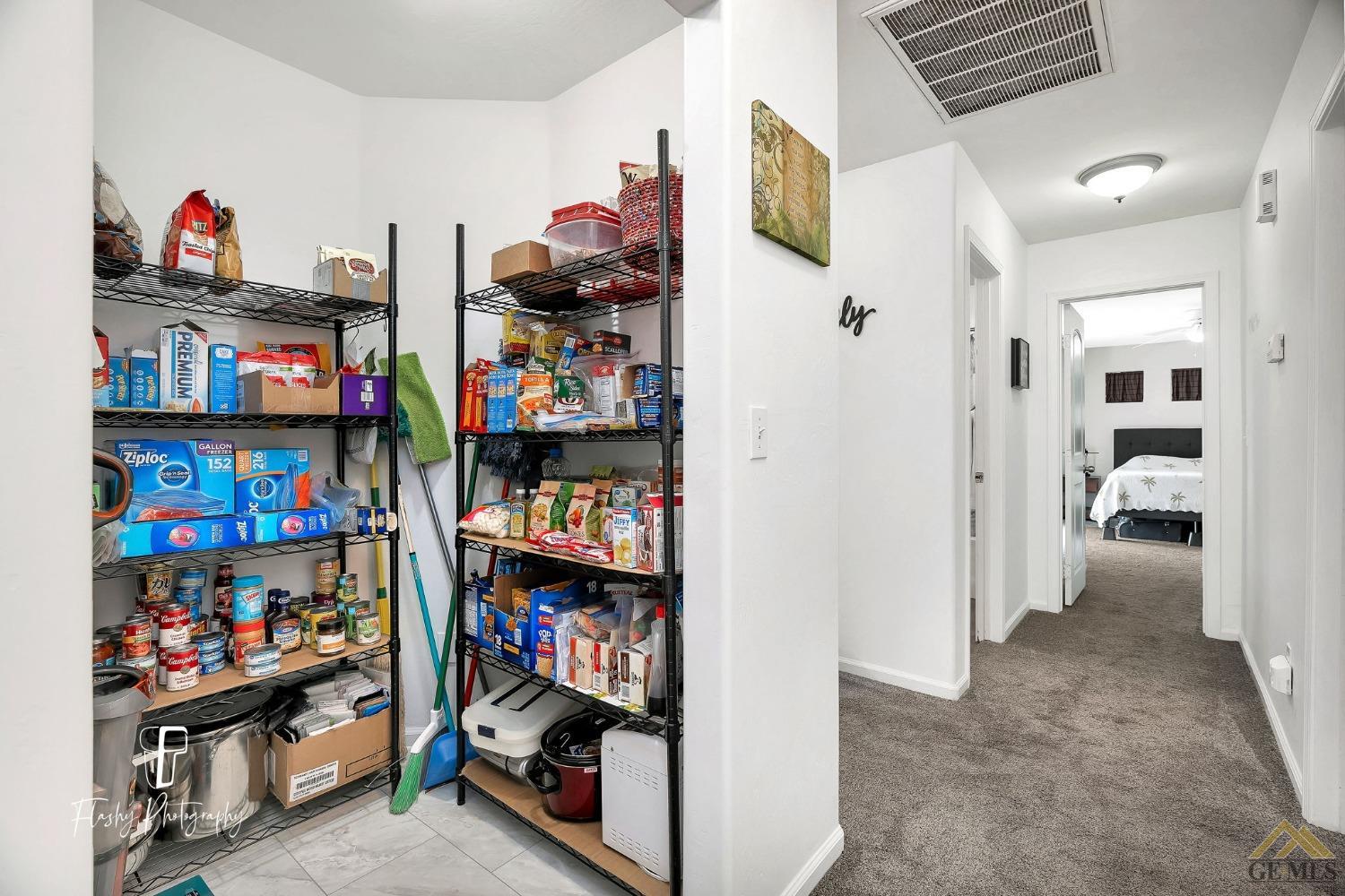 Undisclosed Address Bakersfield, CA 93308 - Photo 10 of 21 a view of a livingroom with shelves