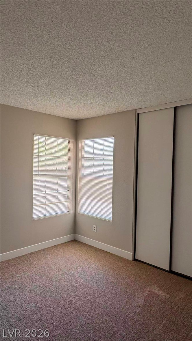 4325 Newcastle Road Las Vegas, NV 89103 - Photo 11 of 18 Well-lit sleeping quarters with a generously sized closet provides ample storage.