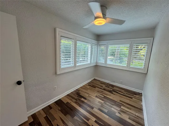 a bedroom with bed and a window