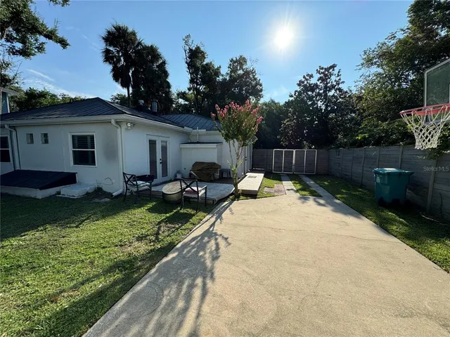 a view of a backyard with a garden and plants