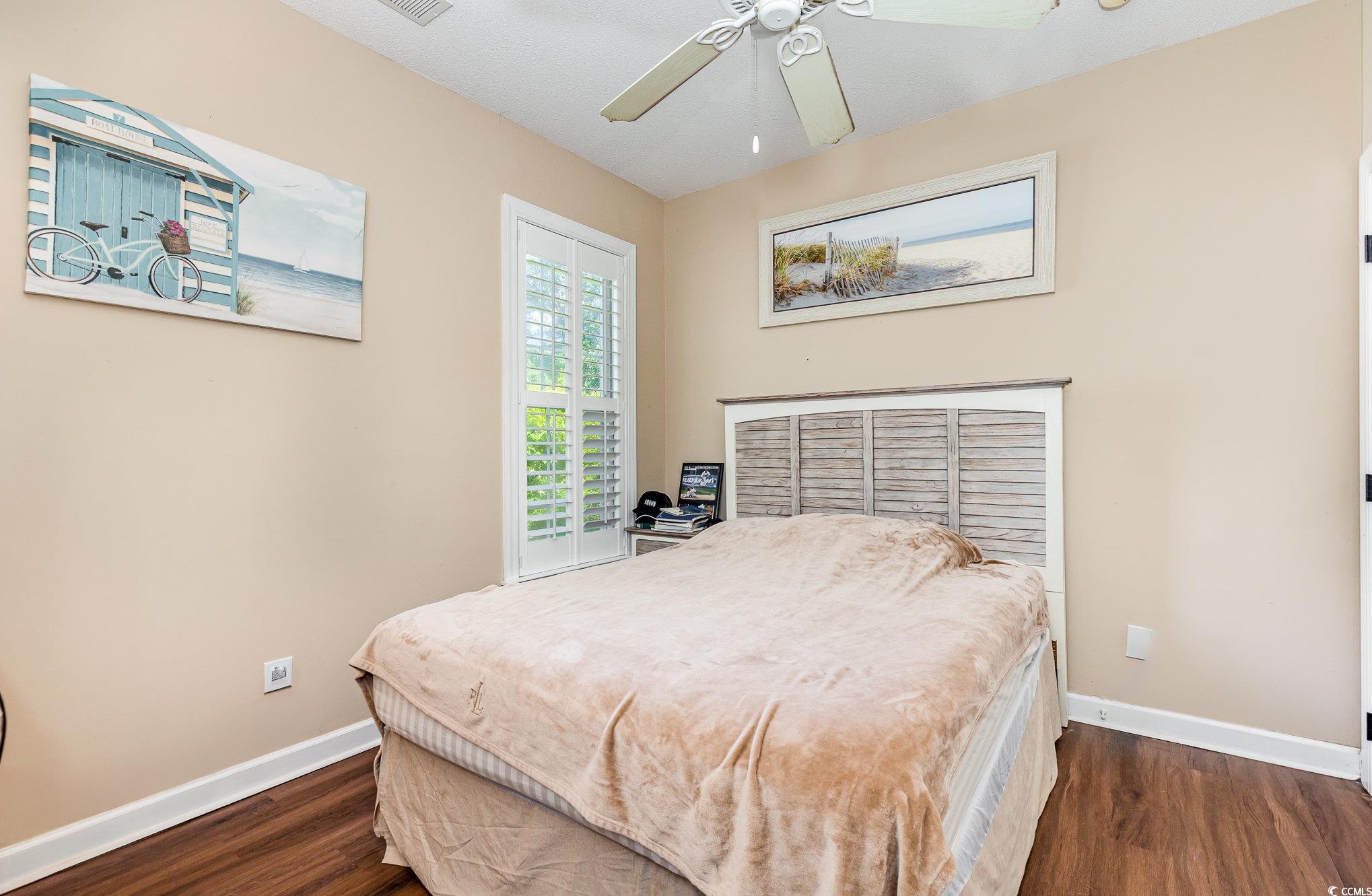 1004 Addington Court Murrells Inlet, SC 29576 - Photo 25 of 40 Bedroom featuring dark wood finished floors and ceiling fan